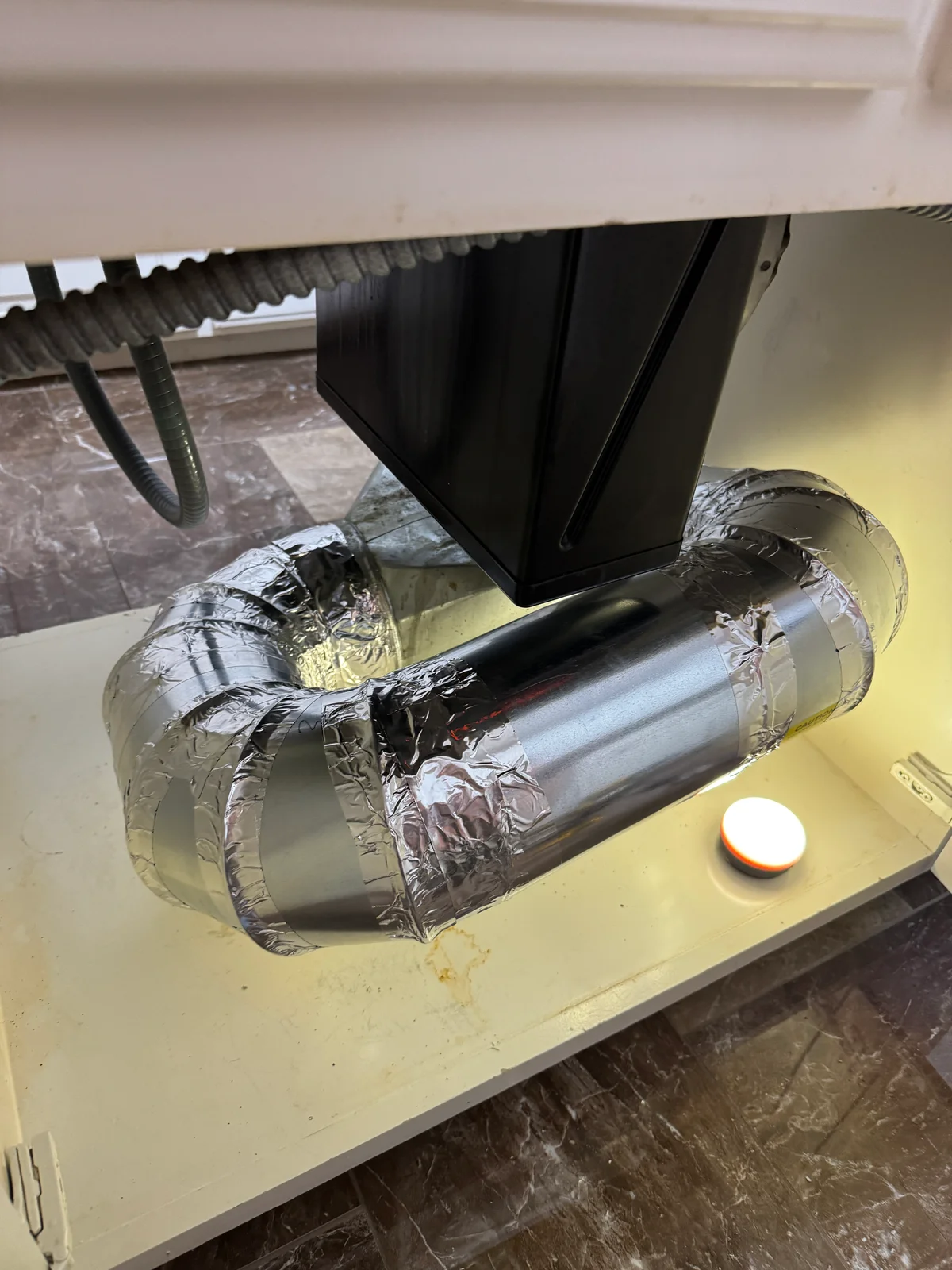 Replacement rigid metal downdraft ductwork with sealed joints beneath a stovetop